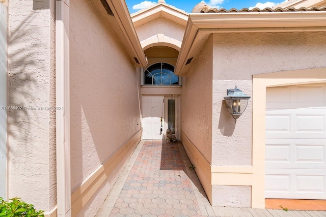 property entrance with a garage