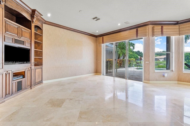 unfurnished living room with a wealth of natural light, ornamental molding, and a textured ceiling