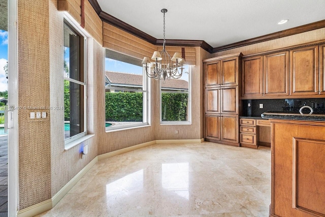 kitchen featuring pendant lighting, decorative backsplash, a chandelier, and ornamental molding