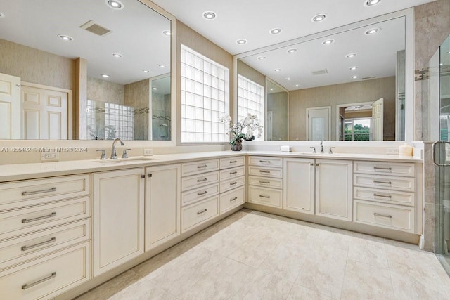 bathroom featuring vanity and a shower with shower door