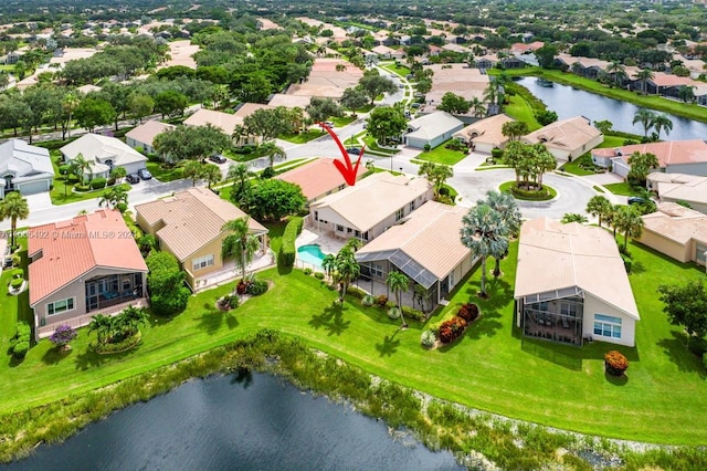 birds eye view of property with a water view