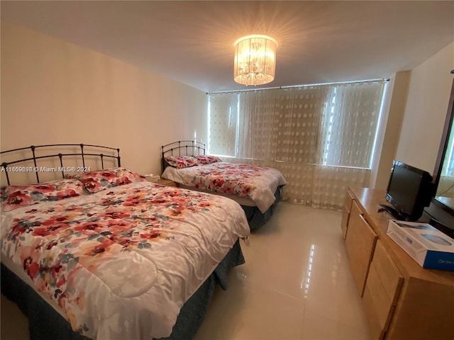 bedroom with a notable chandelier