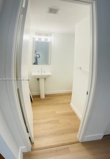 bathroom featuring hardwood / wood-style flooring