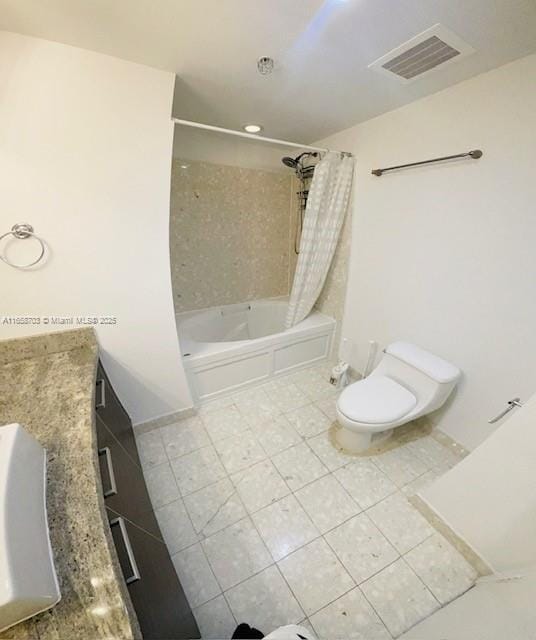 full bathroom with tile patterned floors, shower / bath combination with curtain, toilet, and vanity