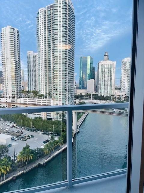 balcony featuring a water view