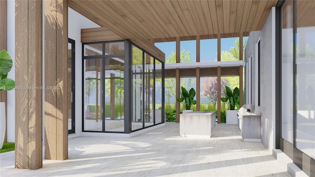 unfurnished sunroom with wooden ceiling