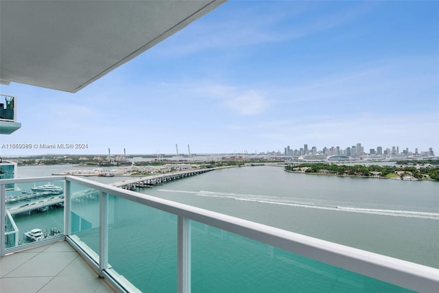 balcony featuring a water view