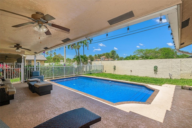 view of pool featuring a patio area and ceiling fan