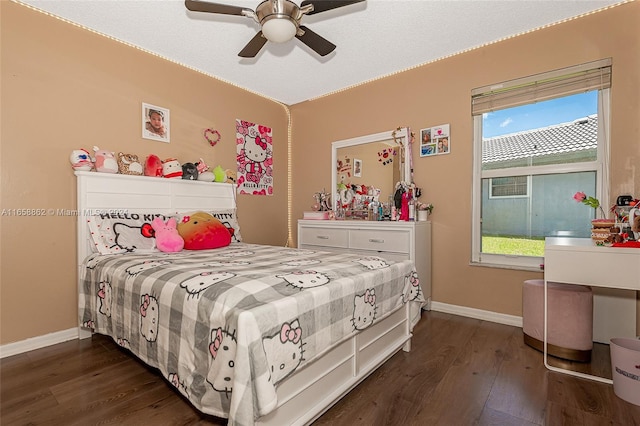 bedroom featuring ceiling fan and dark hardwood / wood-style floors