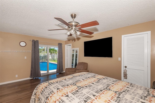 bedroom with dark hardwood / wood-style flooring, access to exterior, ceiling fan, and a closet