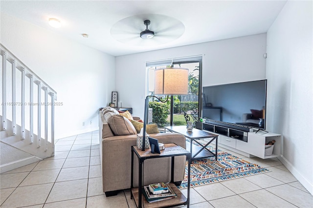 tiled living room with ceiling fan