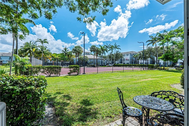 view of yard featuring tennis court