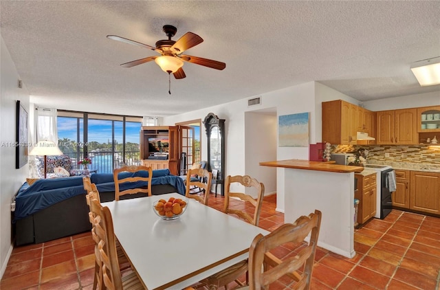 2500 NE 135th St Unit C301, North Miami, FL 33181 - tiled dining space featuring a textured ceiling and ceiling fan