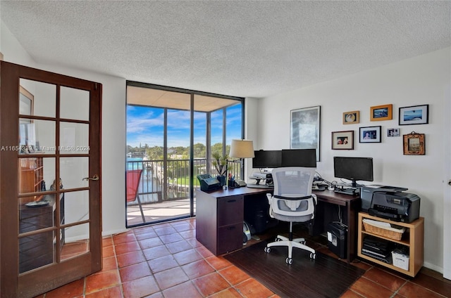 2500 NE 135th St Unit C301, North Miami, FL 33181 - office featuring floor to ceiling windows, a textured ceiling, and tile patterned flooring