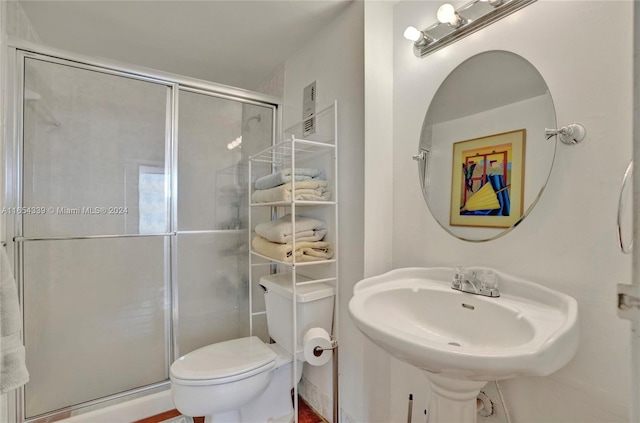 2500 NE 135th St Unit C301, North Miami, FL 33181 - full bathroom with toilet, a stall shower, and a sink