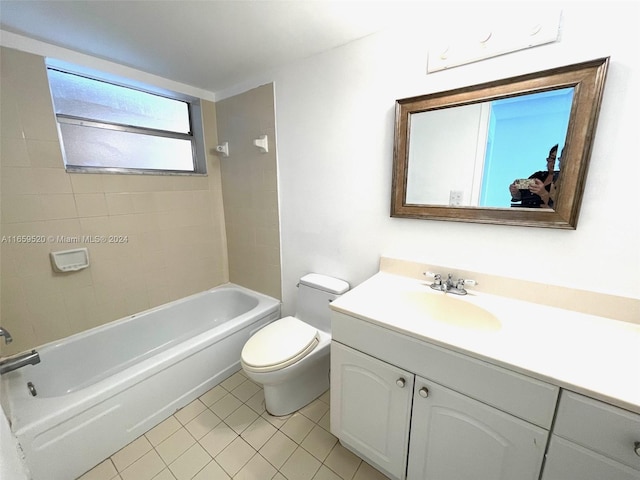 full bathroom with tiled shower / bath, vanity, toilet, and tile patterned flooring