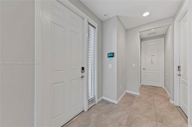 foyer entrance with baseboards