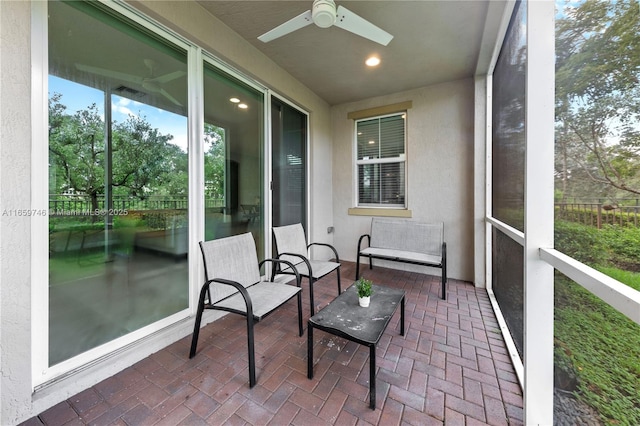 sunroom / solarium with ceiling fan