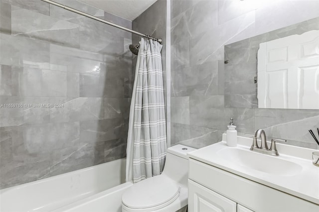 full bathroom featuring vanity, toilet, shower / tub combo with curtain, and tile walls