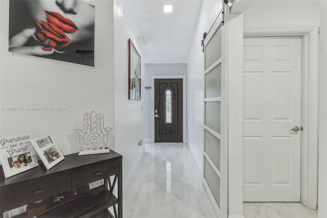 foyer entrance featuring a barn door