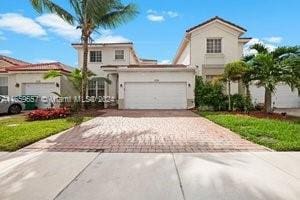 mediterranean / spanish-style house featuring a garage