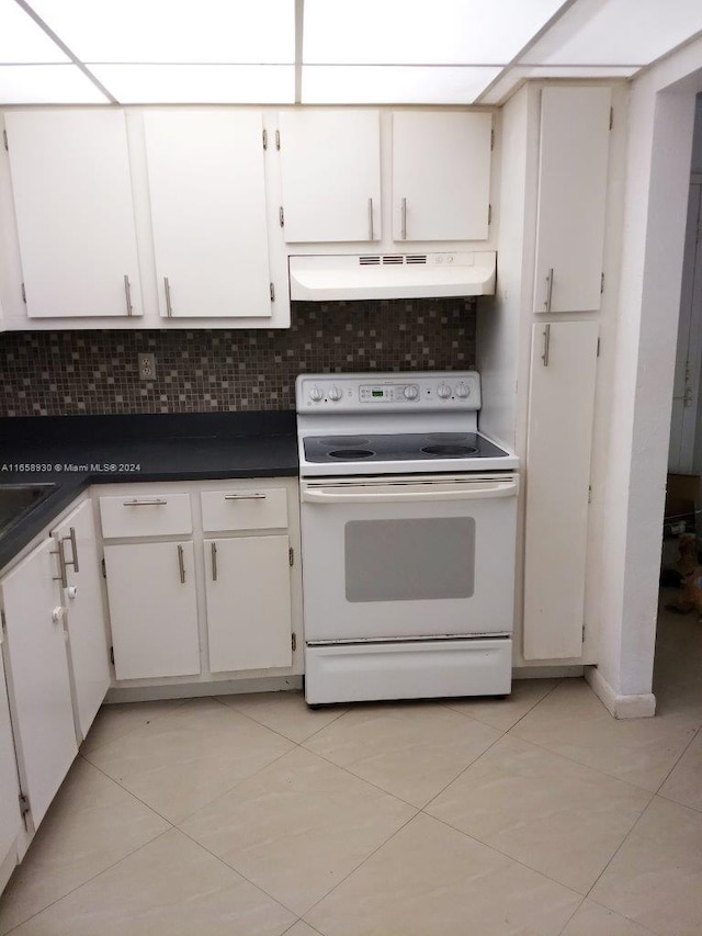 kitchen with white cabinets, tasteful backsplash, electric range, and light tile patterned floors