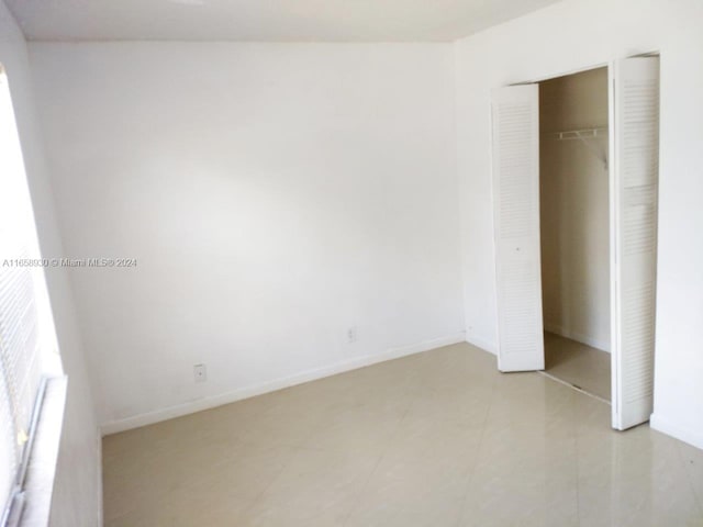 unfurnished bedroom with a closet