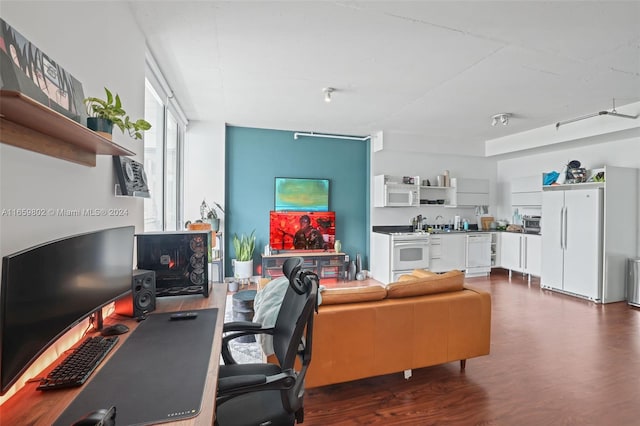 office with dark hardwood / wood-style flooring