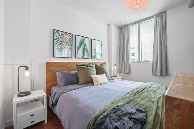 bedroom featuring dark hardwood / wood-style flooring