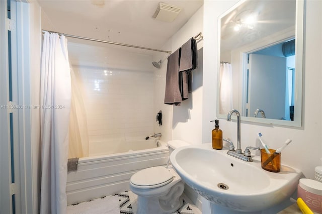 full bathroom with toilet, tile patterned flooring, sink, and shower / bath combo