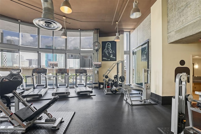 workout area featuring a high ceiling