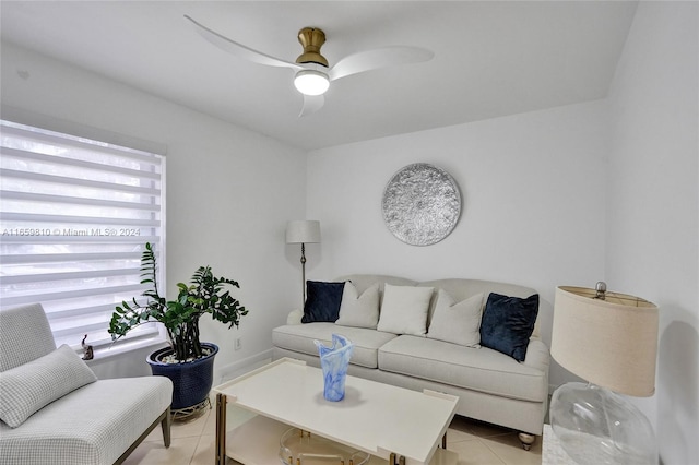 living room featuring ceiling fan and light tile patterned floors