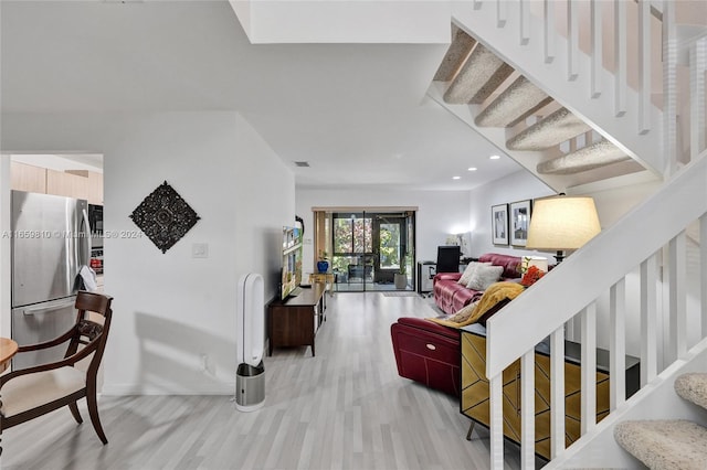 living room with light hardwood / wood-style floors