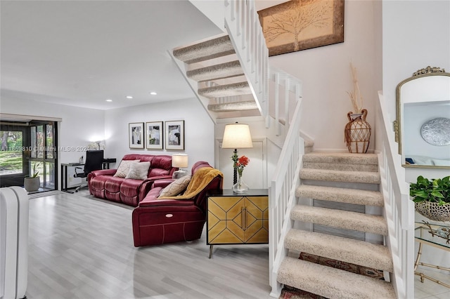 living room with light hardwood / wood-style flooring