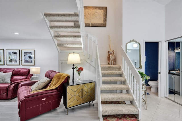 stairs with sink and tile patterned floors