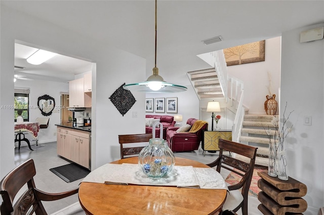 dining space with ceiling fan