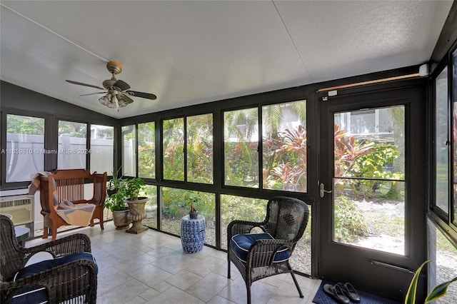 sunroom featuring vaulted ceiling, a wealth of natural light, and ceiling fan