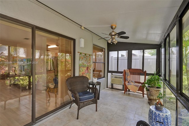 sunroom with ceiling fan and vaulted ceiling