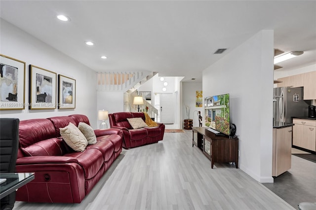 living room with light hardwood / wood-style floors