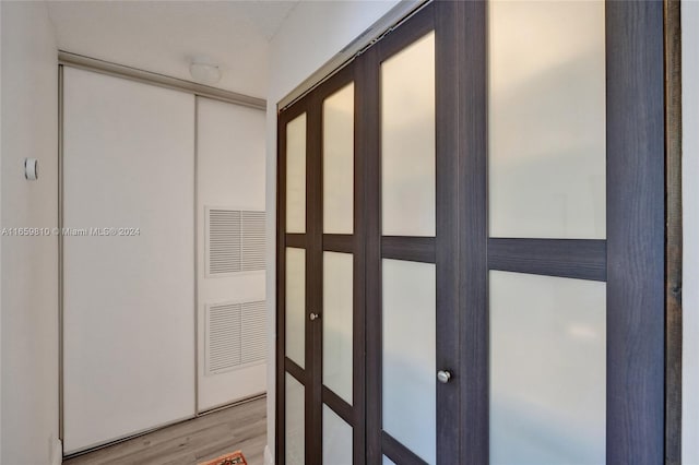 hallway with light wood-type flooring