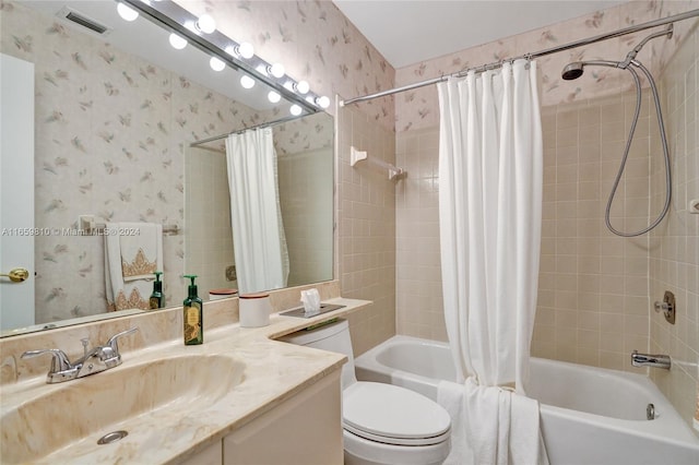 full bathroom featuring vanity, toilet, and shower / bath combo with shower curtain