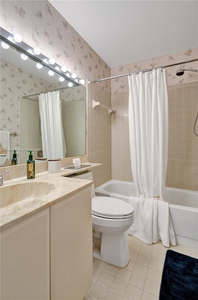 full bathroom featuring tile patterned flooring, vanity, toilet, and shower / bathtub combination with curtain