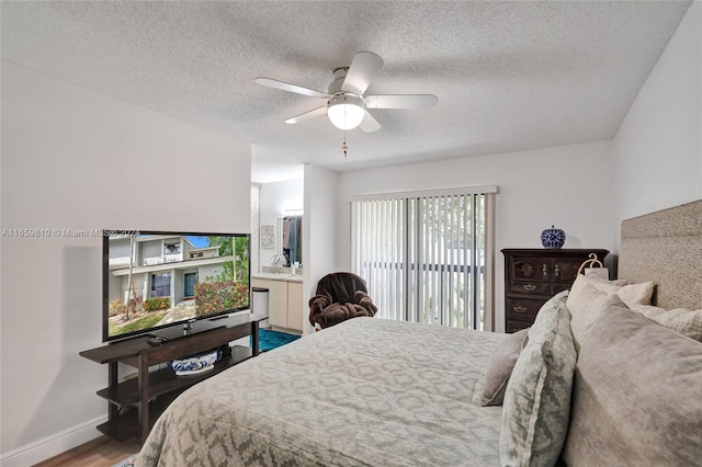 bedroom featuring a textured ceiling, hardwood / wood-style flooring, and ceiling fan