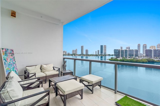 balcony featuring a water view