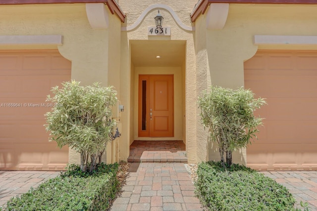 entrance to property featuring a garage