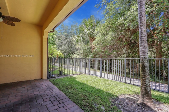 view of yard featuring ceiling fan