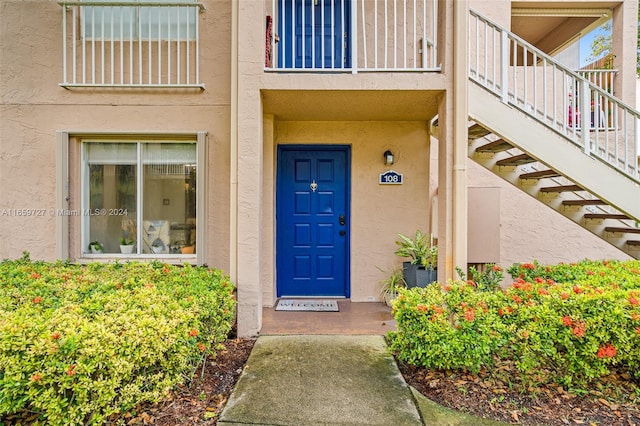 doorway to property featuring a balcony