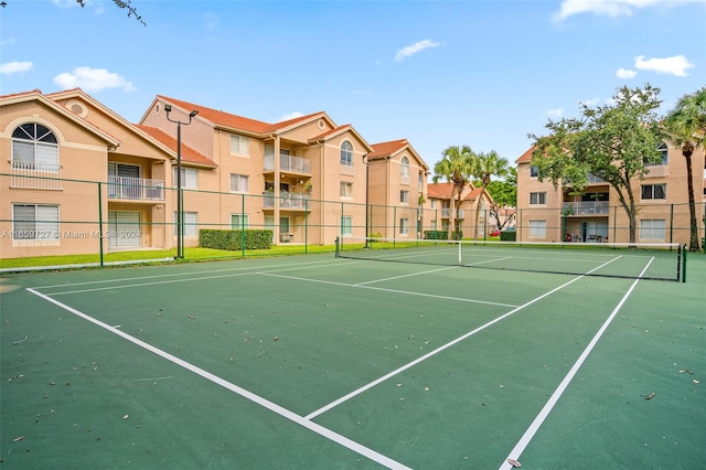 view of sport court featuring basketball hoop