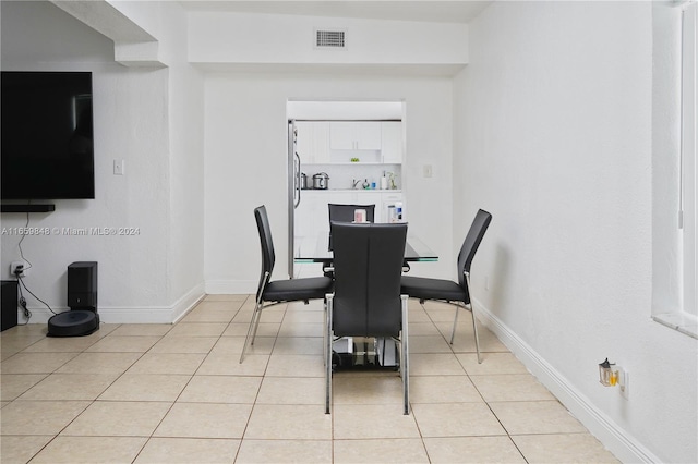 dining area with light tile patterned floors