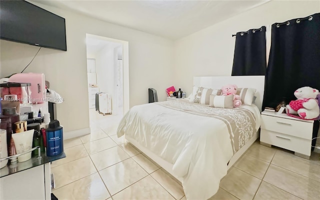 bedroom with light tile patterned floors